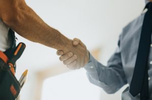 technician-and-homeowner-shaking-hands